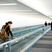 people travelling in airport escalators