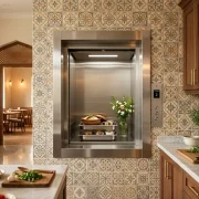 Modern stainless steel dumbwaiter lift installed in a stylish Pakistani restaurant or home kitchen, designed for convenient food and item transport between floors